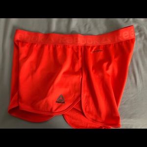 Orange Speedwick Reebok athletic shorts
